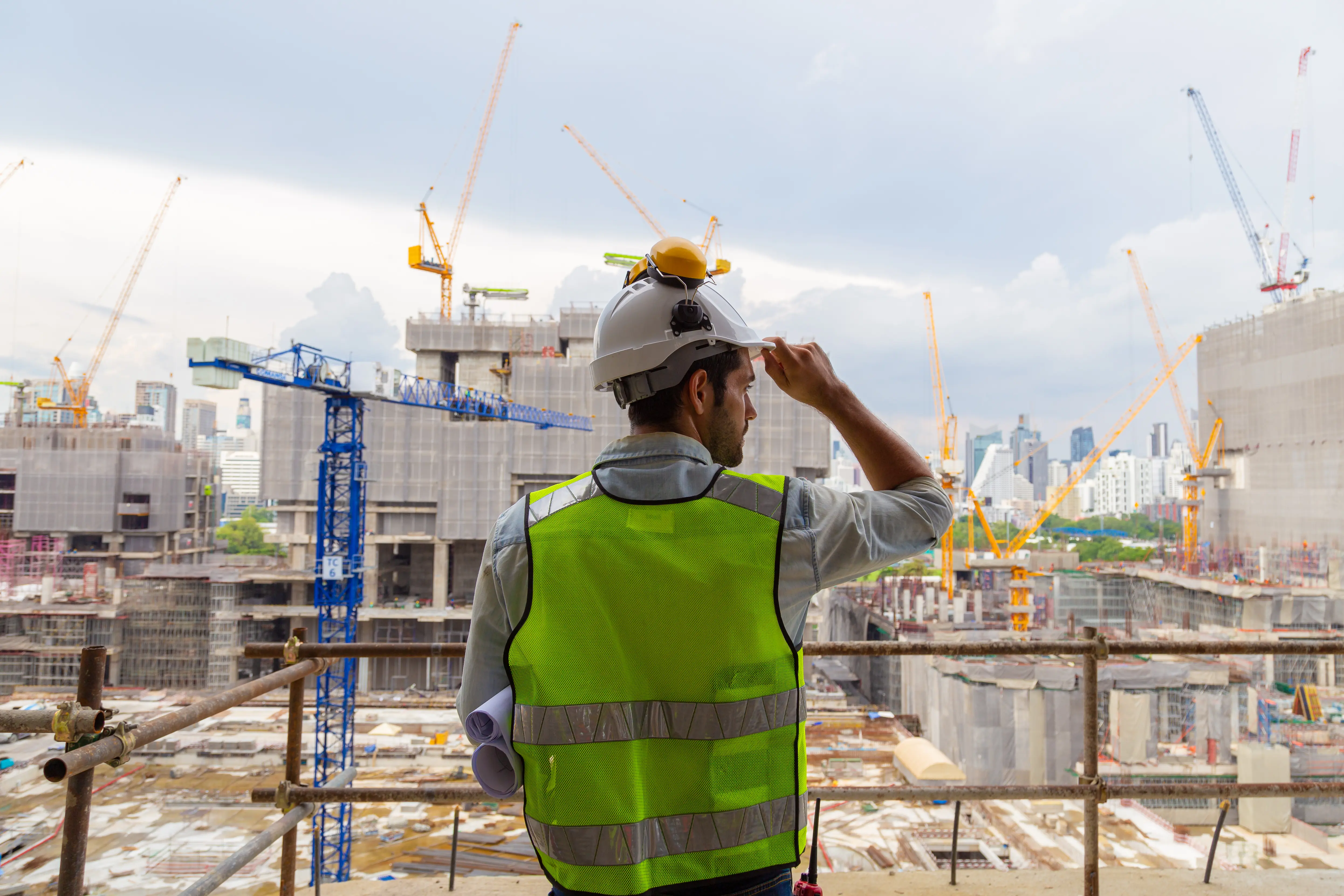 Two construction workers planning a project.